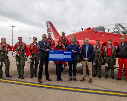 Hounds for Heroes staff with Red arrows at cheque prsentation