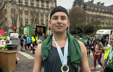 Guy with Paris Marathon Medal 