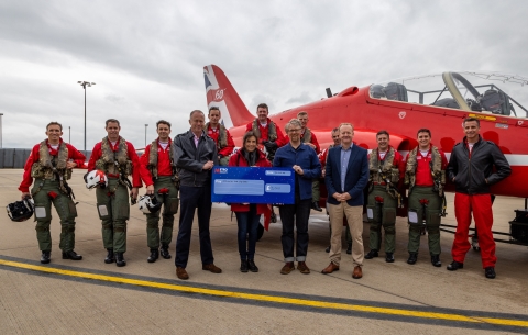 Hounds for Heroes staff with Red arrows at cheque prsentation