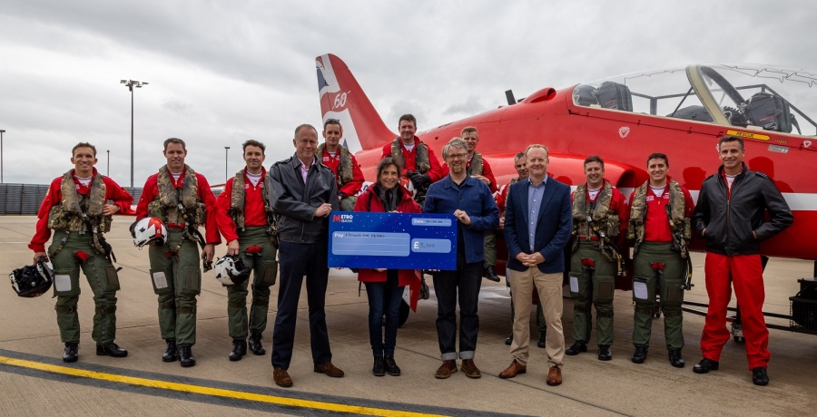 Hounds for Heroes staff with Red Arrows members being awarded a cheque